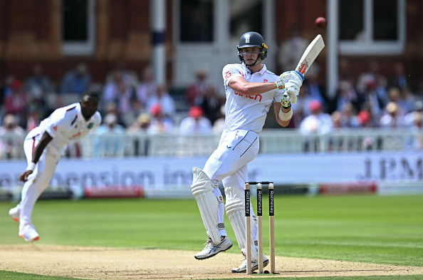 A county age group player batting in a match